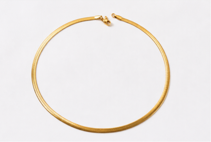 Gold necklace on a white background