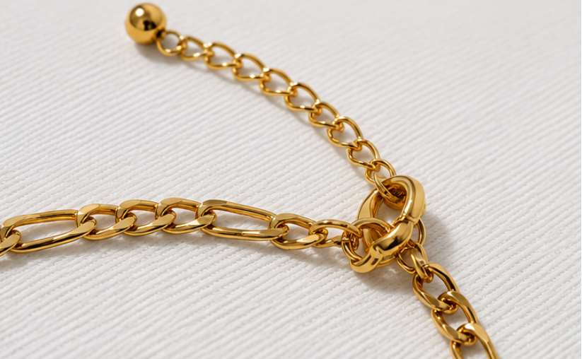 Gold chain bracelet on a white background